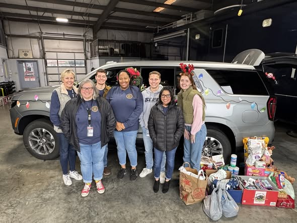 Photo of people organizing the pet food donations