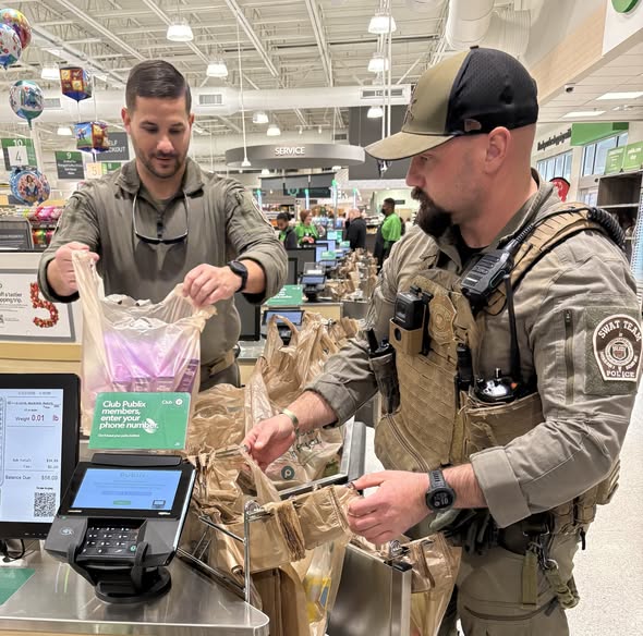 SLED Agents bag groceries for customers