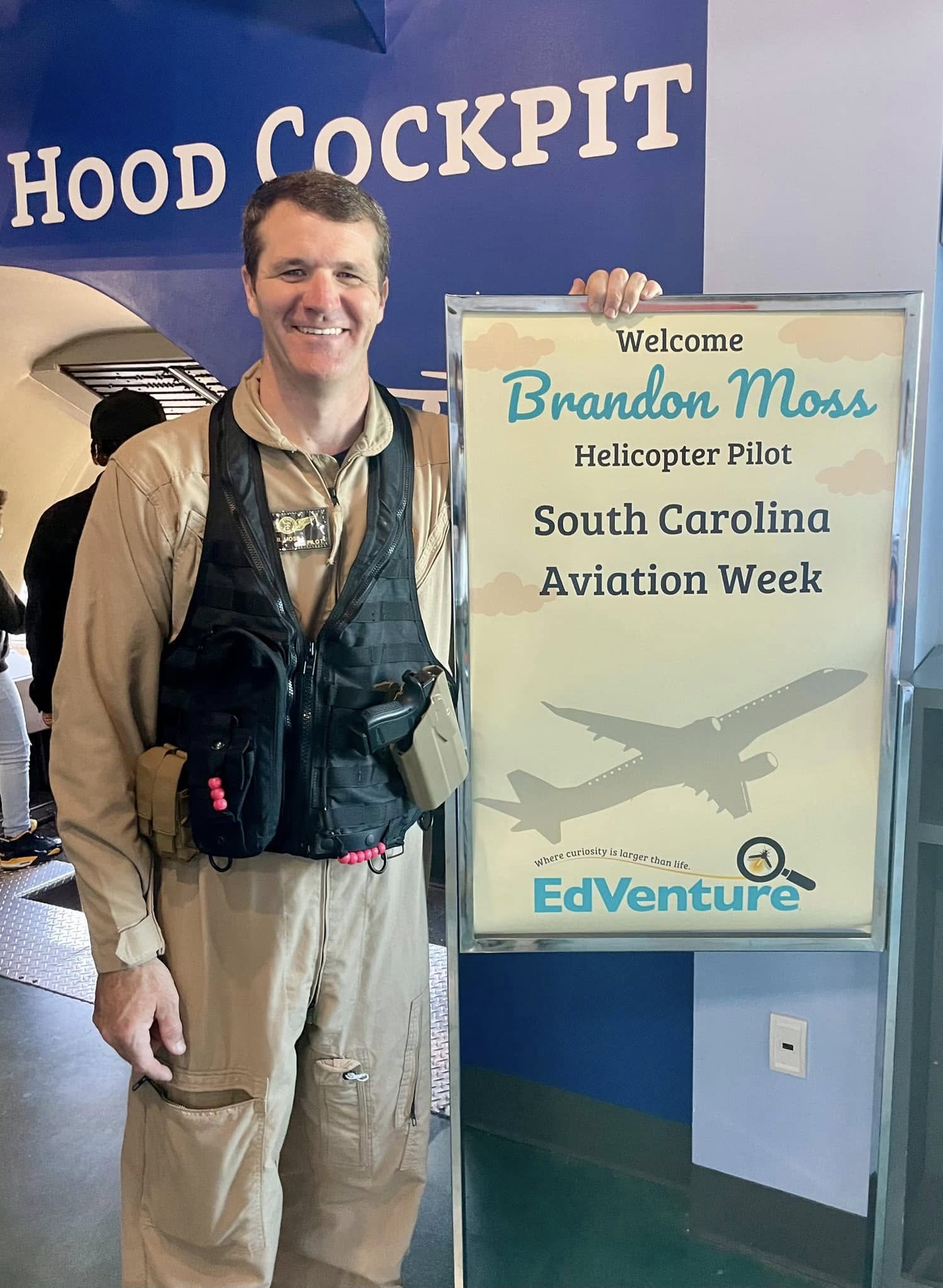 Brandon Moss stands with welcome sign at the EdVenture Museum
