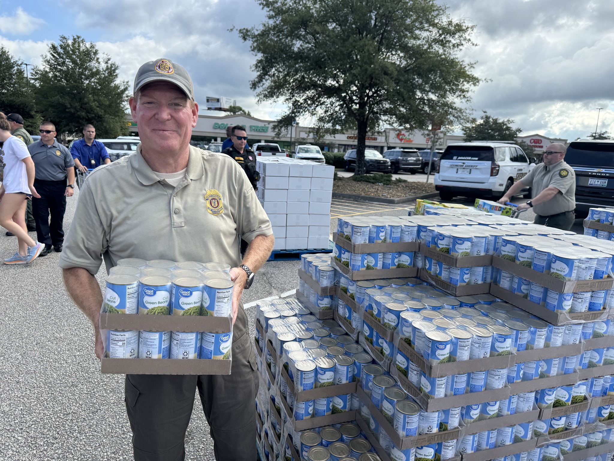 More helpers loading food at donation location