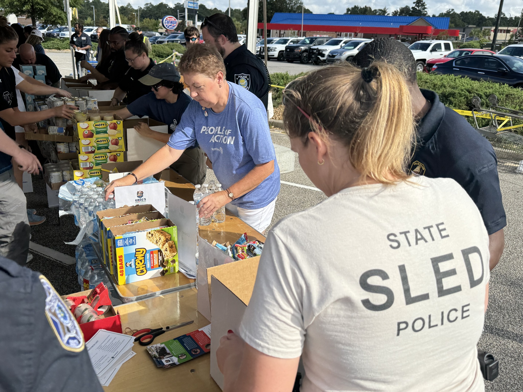 SLED employees joins others in packing food boxes for hurricane survivors 